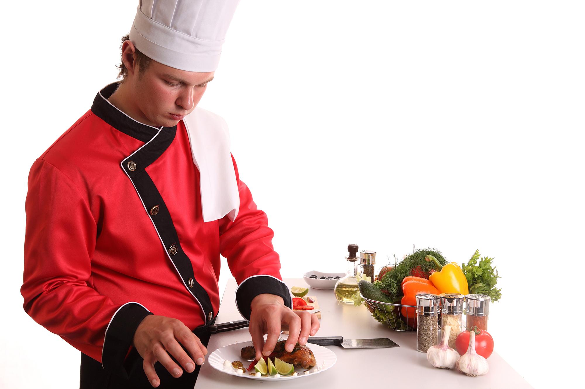 Instructor demonstrating a plated dish in a bright kitchen